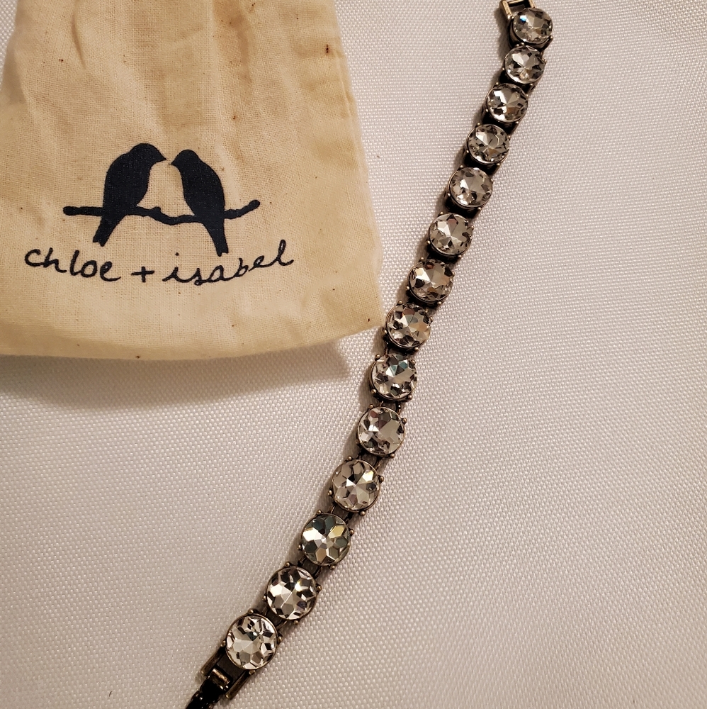 Crystal bracelet /Chloe and Isabel/ clear stones. Brass metal. Comes w bag
